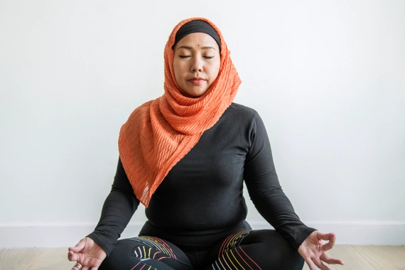 Asian men practicing Butterfly Yoga pose