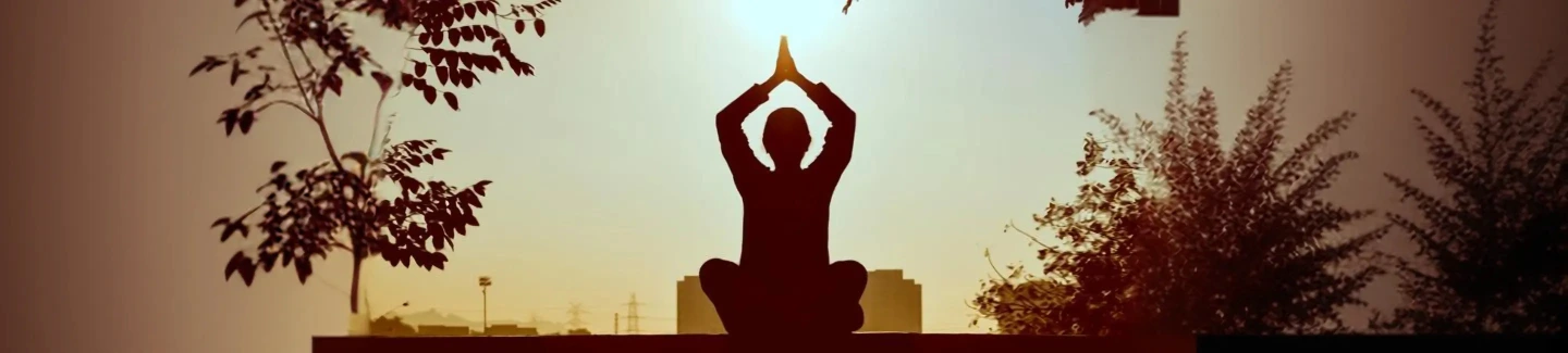Silhouette of a person meditating, illustrating the path to spiritual and personal growth