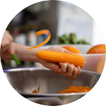 A smiling male with both his palms facing downwards performing breathing exercise