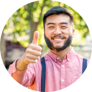 Asian man showing thumbs up with smile and confidence 