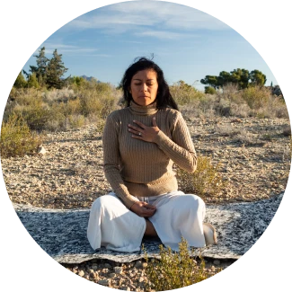 Woman practicing yoga meditation in nature under a tree