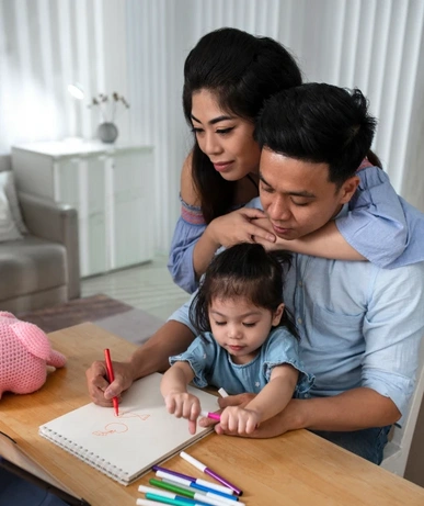 A joyful family of three enjoying quality time, highlighting the importance of bonding
