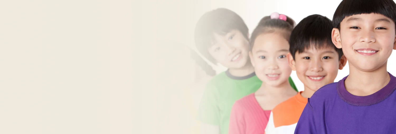 Kids in in colorful t-shirts smiling gently 