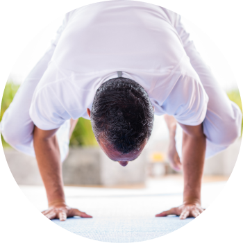 A man performing yoga showcasing core strength and balance
