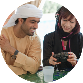 A young boy and girl looking at their camera being confident and building good social skills