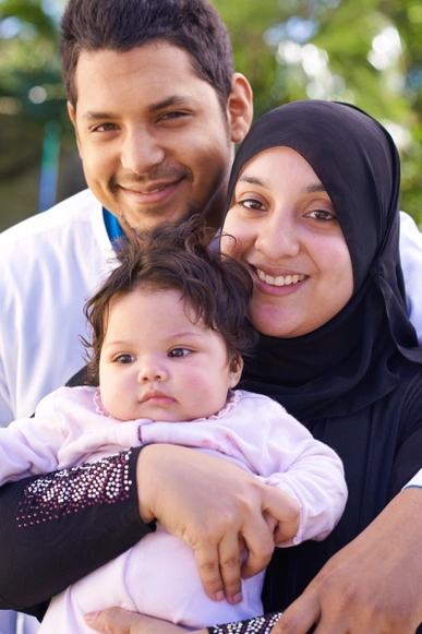 A joyful family of three enjoying quality time, highlighting the importance of bonding