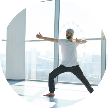 Man performing yoga on a spacious high rise building