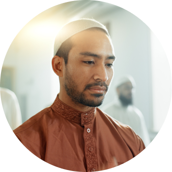 A young Muslim man focusing on his breath 